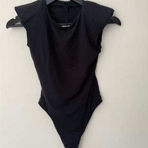 Unravel Project authentic open back black bodysuit. Size S, new with tag